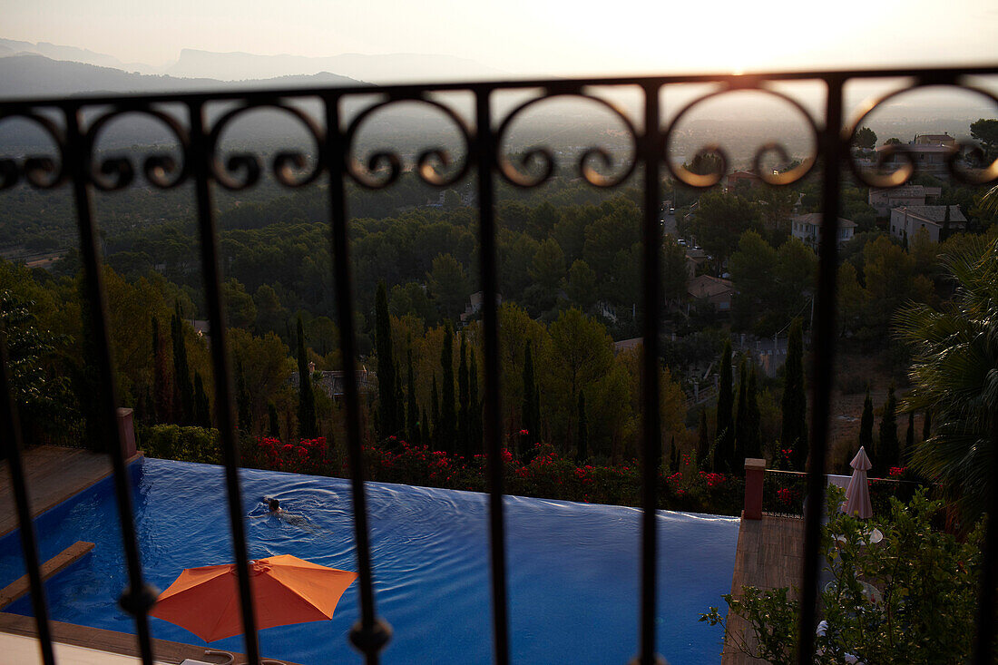 View from a balcony over the swimming pool towards the mountains, Mallorca, Balearic Islands, Spain