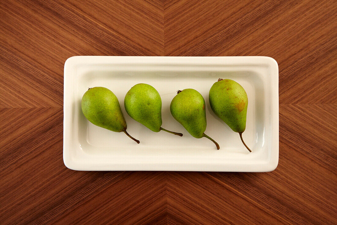 Four pears in a dish on a table, Fruit, Food