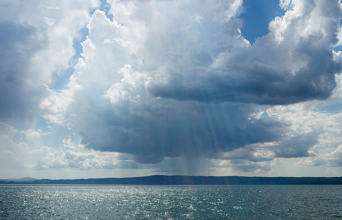 Cumulus clouds above Lago di Bolsena, Crater lake near Bolsena, province of Viterbo, Lazio, Italy, Europe