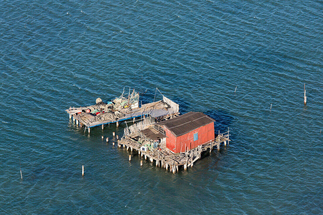 Aerial view of islands in the Venetian lagoon, Fishing huts on stilts, Pellestrina, Mediterranian Sea, Veneto, Italy
