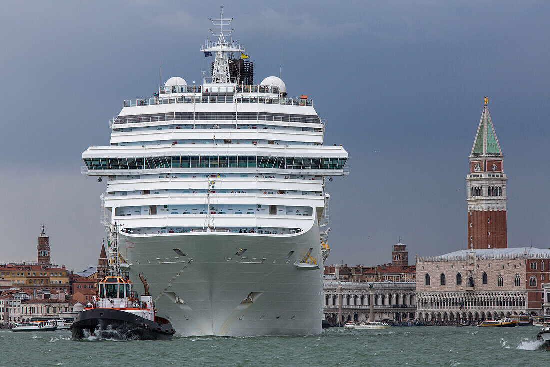 Cruise ship being towed in Giudecca Canal, No Grandi Navi, near San Giorgio Maggiore, Venice, Italy