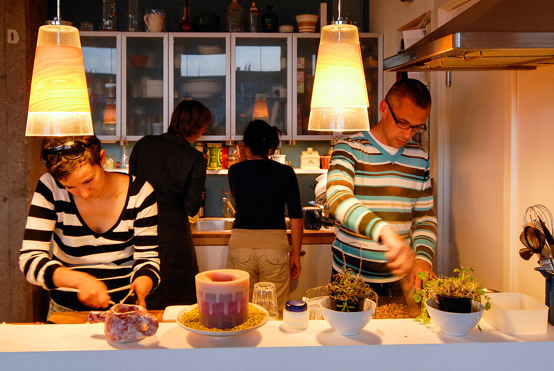 Couples cooking in a kitchen, Leipzig, Saxony, Germany