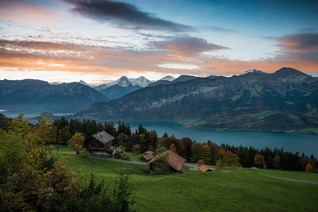 View over Lake Thun to sunrise above Eiger, Moench and Jungfrau, Beatenberg, Bernese Oberland, Canton of Bern, Switzerland