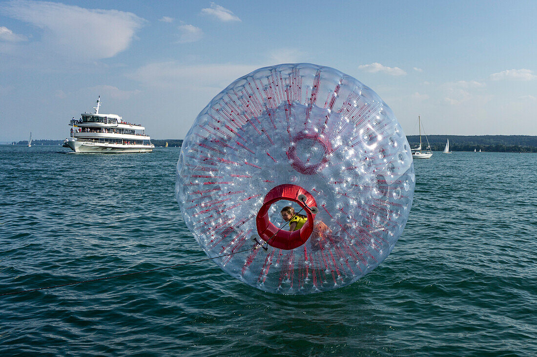 Fun Ball on Lake Constance in Ueberlingen, Ferry in the background, Baden-Wuerttemberg, Germany, Europe