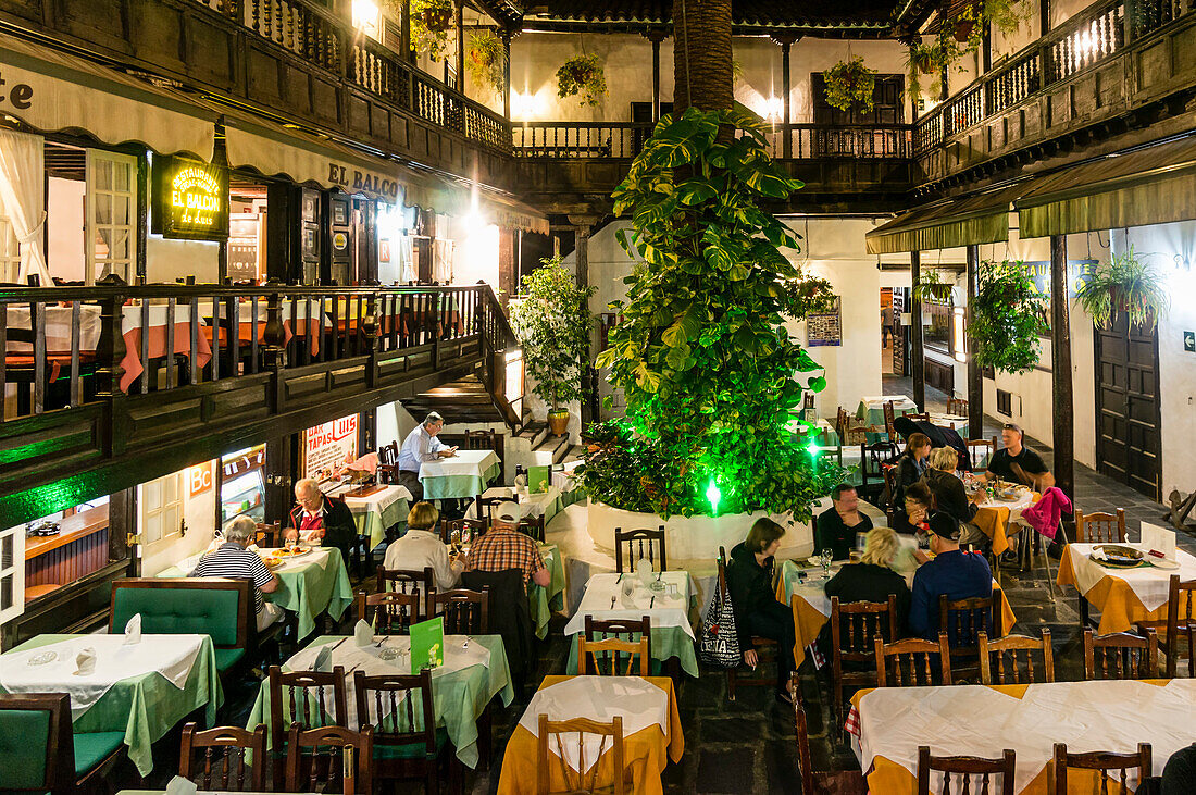 Restaurants in the courtyard, El Rincon at Plaza del Charco, historic building from 17. Century, Puerto de la Cruz, Tenerife, Canary Islands, Spain