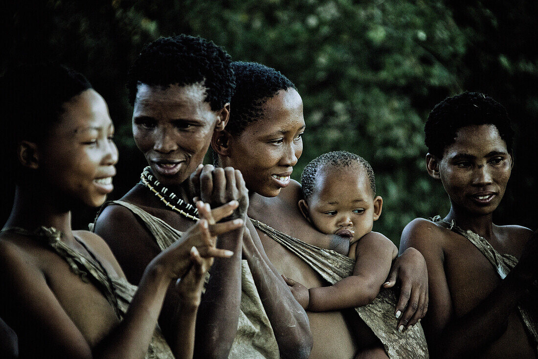 Four women and a baby of the San tribe, Otjozondjupa region, Namibia, Africa