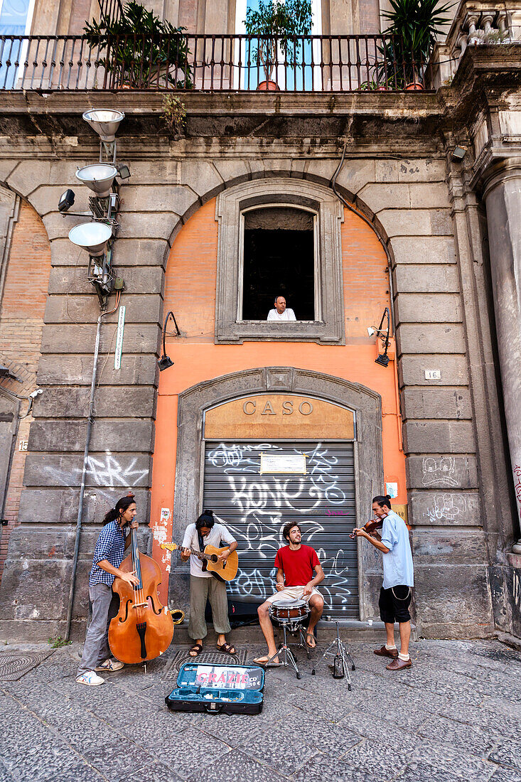 Street musicians in the old town of Naples, Bay of Naples, Campania, Italy
