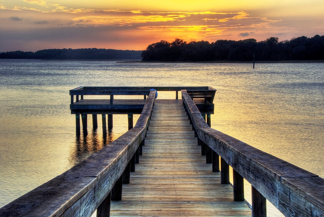A pier at sunset on the Intracoastal Waterway on Hilton Head Island, South Carolina Hilton Head Island, South Carolina, USA