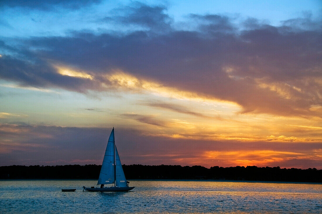 A sailboat at sunset on Hilton Head Island, South Carolina Hilton Head Island, South Carolina, USA
