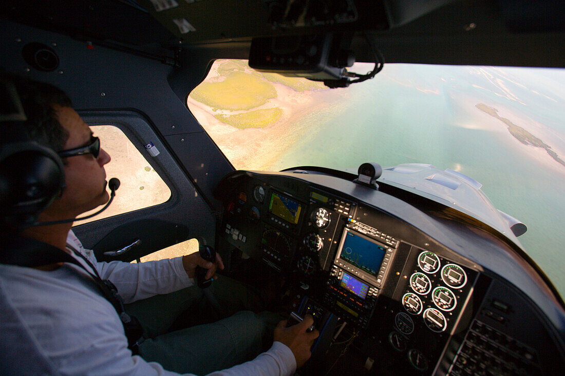 A cockpit view of a pilot looking down at the florida keys Florida, U.S.A.