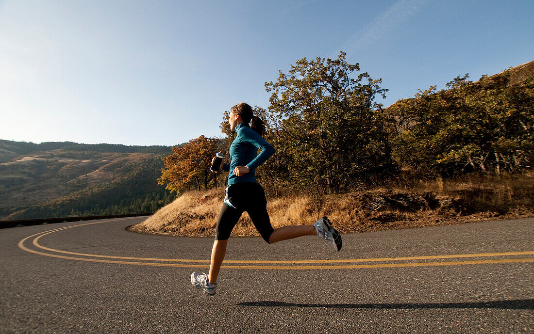 An athletic woman jogging in the License image 70463215