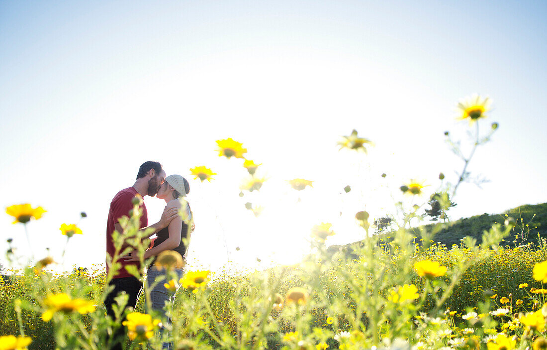 A young couple poses for a portrait in Ventura, California Ventura, California, USA