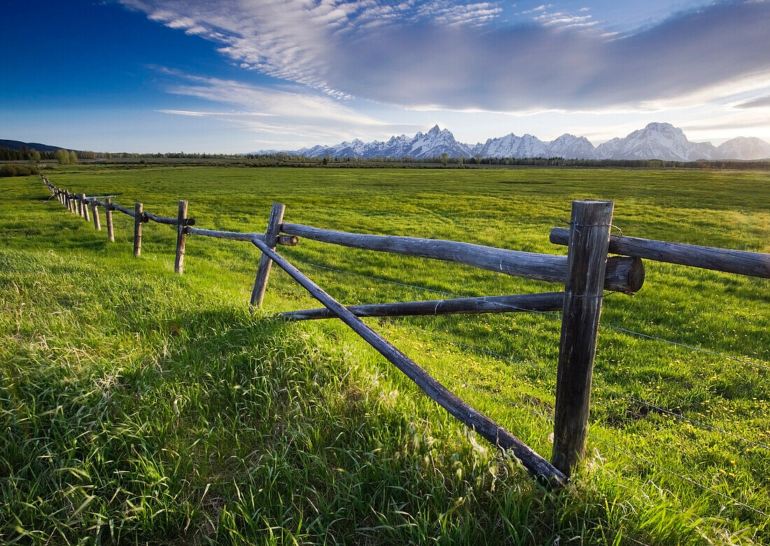 A ranching fence in Grand Teton National Park in late afternoon light, Wyoming Grand Teton National Park, Wyoming, USA