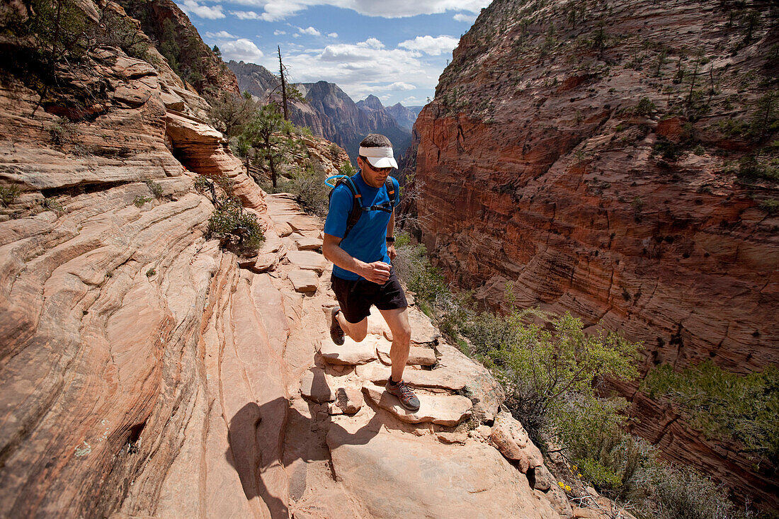 Man trail running in Zion Springdale, Utah, United States