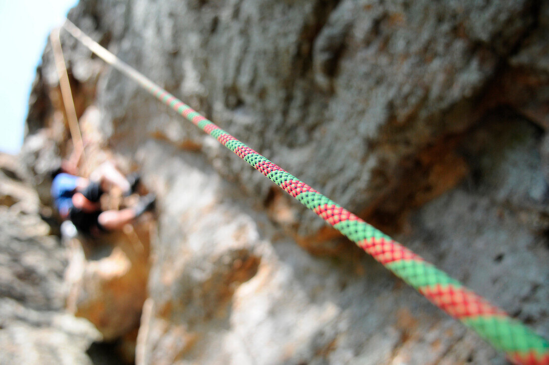 A climbing rope protects a climber from falling at Lake Mineral Wells State Park's Penitentiary Hollow climbing area near Mineral Wells, Texas