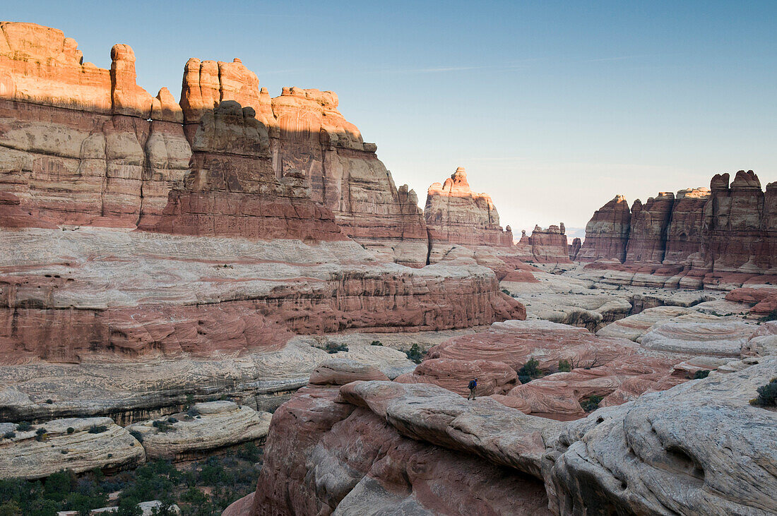 A man hiking in the Needles District of Canyonlands National Park, Monticello, Utah., Monticello, Utah, usa