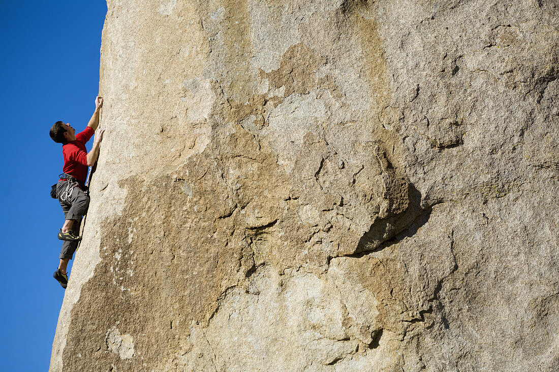 Male lead climbing on a boulder, Bishop, California, United States