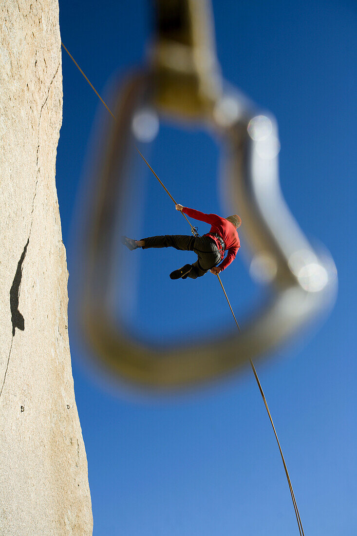 Rappel framed by quickdraw, Bishop, California, United States