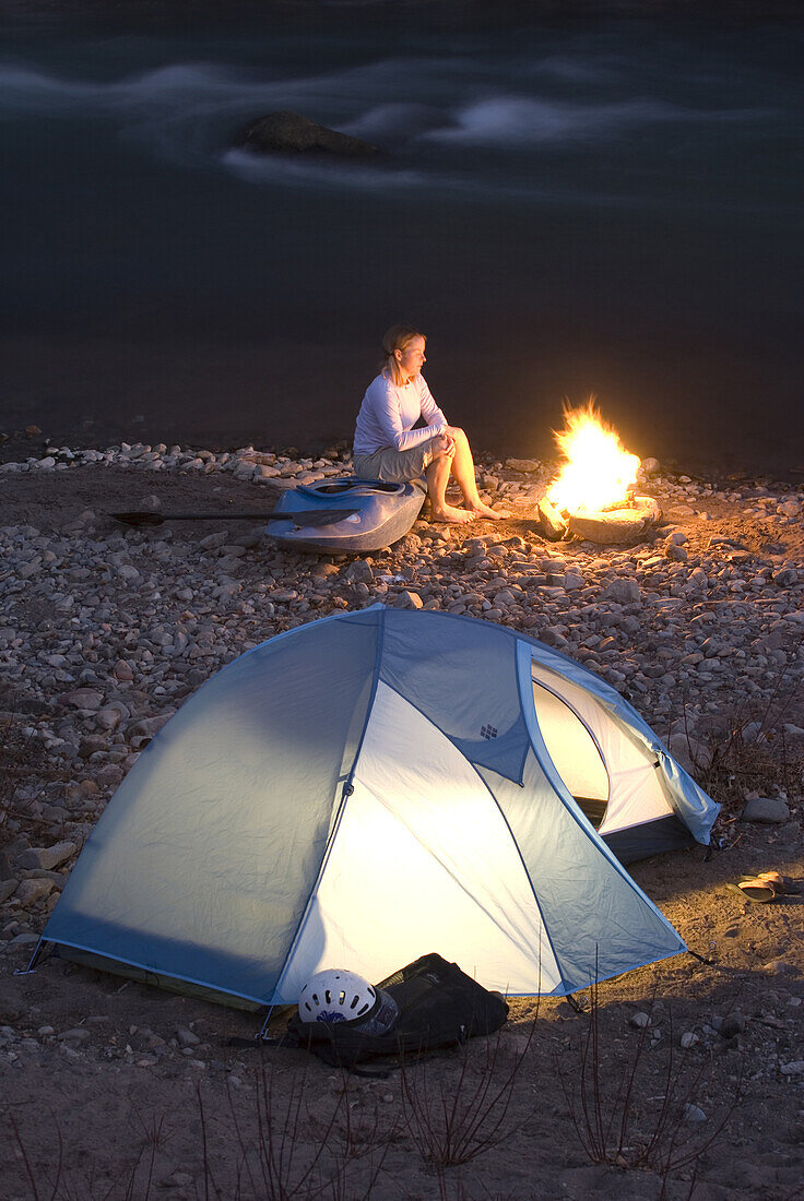 Camp fire and tent by the river Durango, Colorado, United States