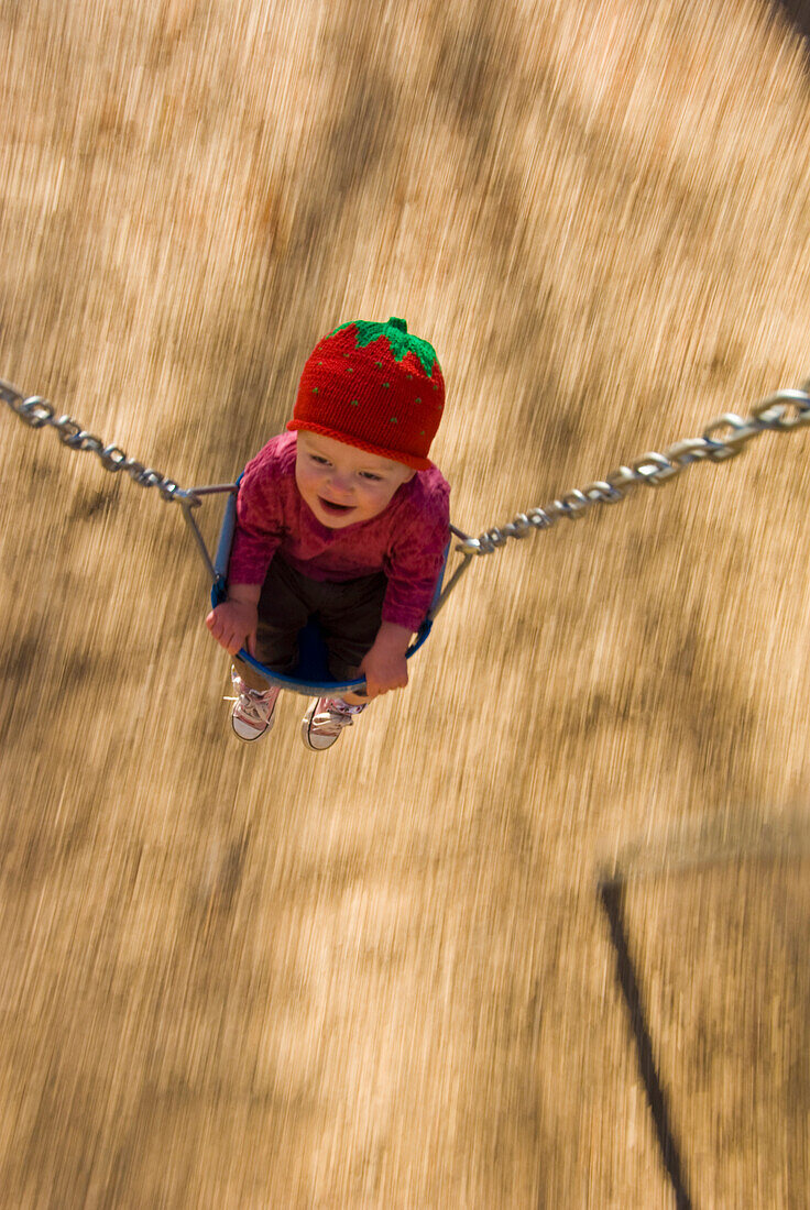 Toddler in swing at town  park, Durango, Colorado (blurred motion) Durango, Colorado, USA
