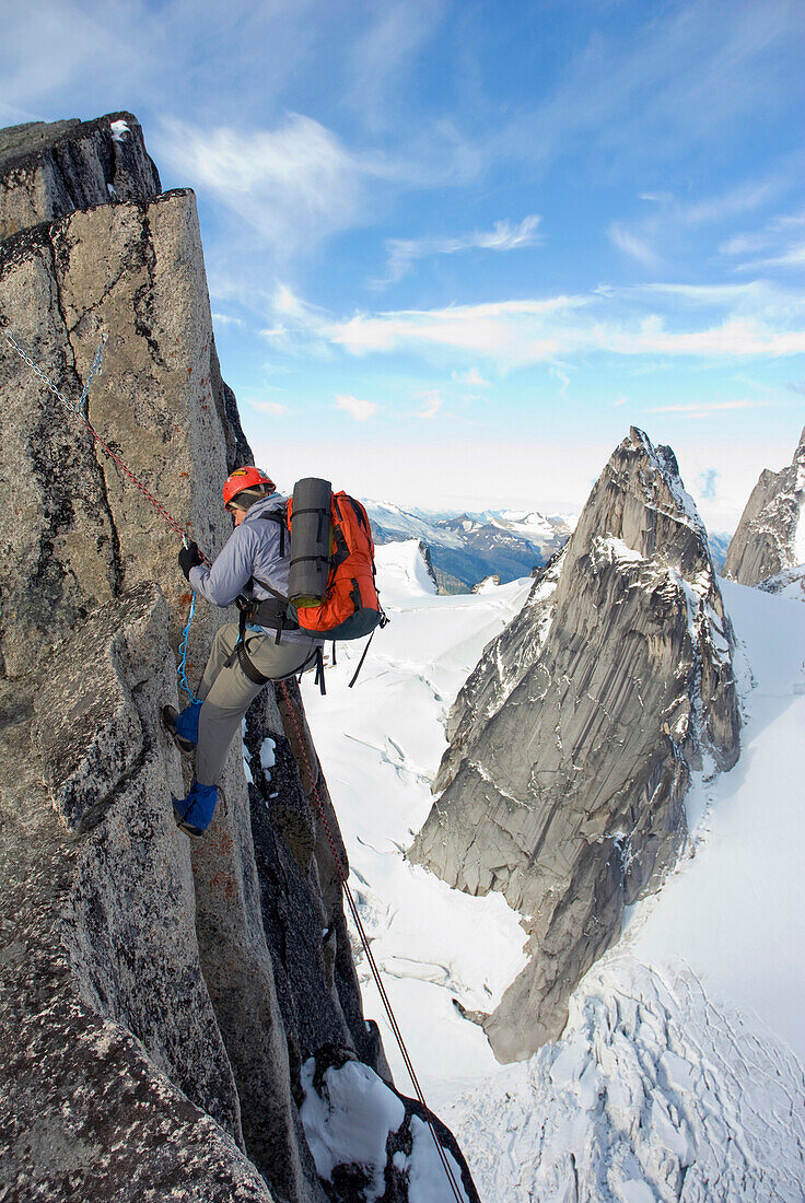 Man rappelling Snowpatch Spire, Bugaboo Provincial Park, British Columbia, Canada Golden, British Columbia, Canada