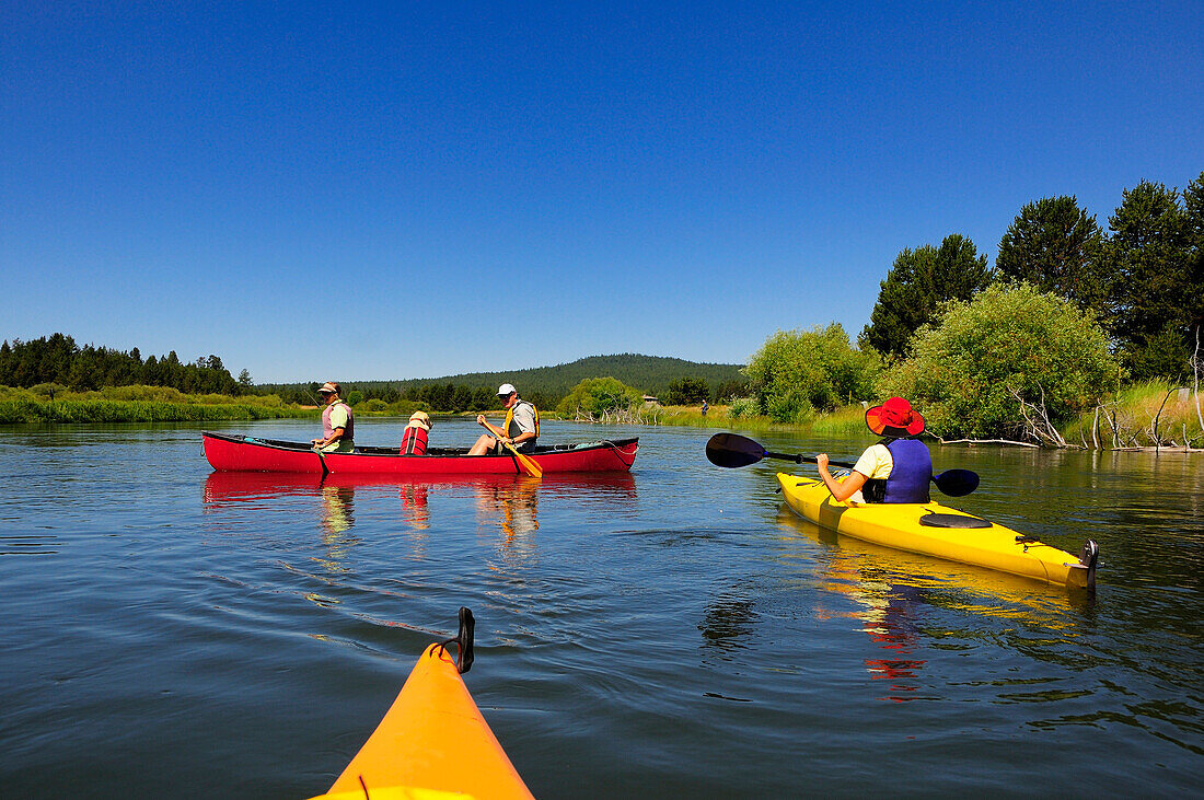 People kayaking and canoeing on a river Bend, Oregon, USA