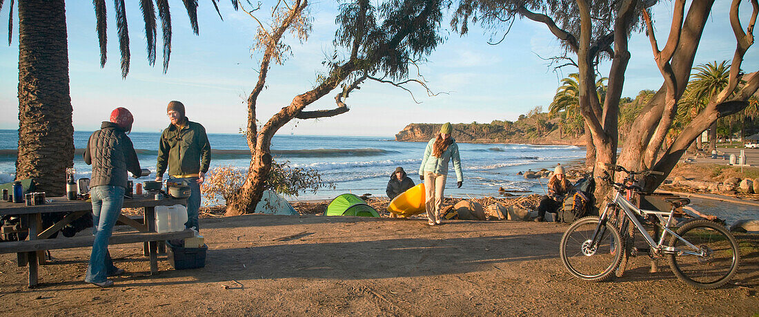 A group of young adults camping at El Capitan State Beach Goleta, California, USA