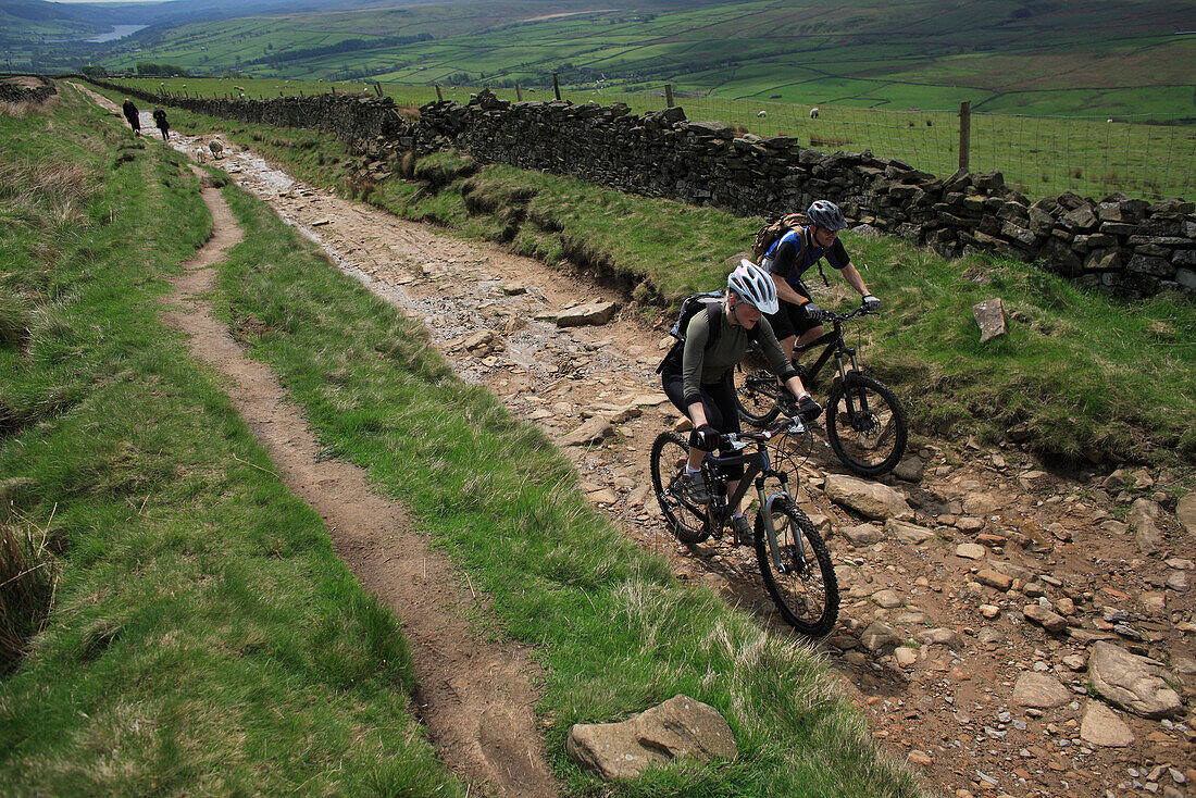 A couple mountain bikes along a rocky path in Yorkshire, England Yorkshire, England