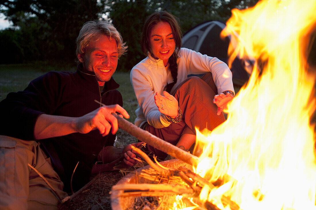 A couple enjoy a campfire in Everglades National Park, Florida Florida, USA