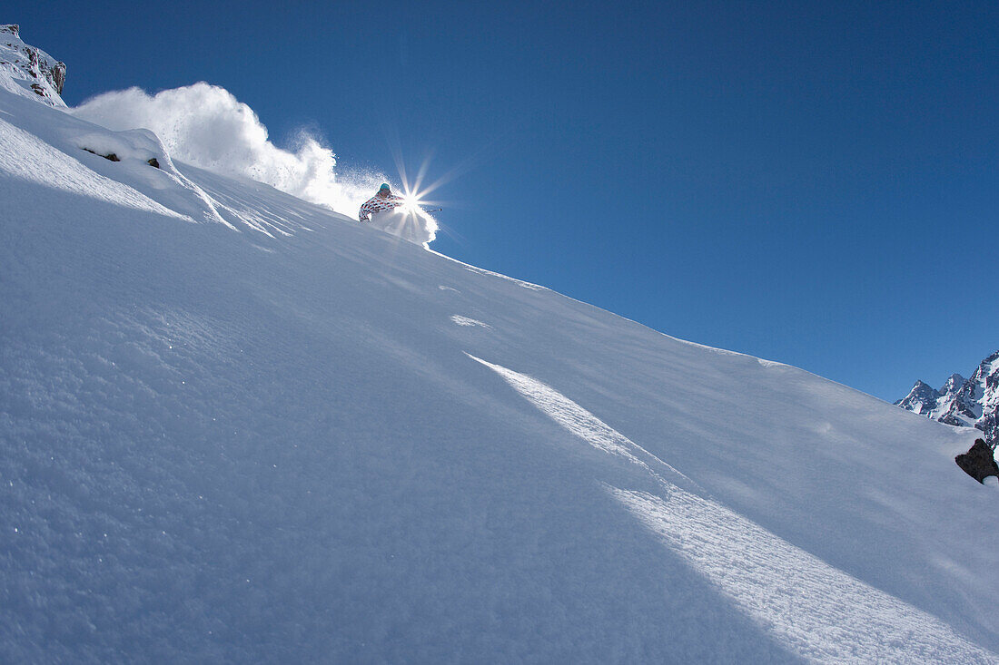 A skier carves in perfect powder in Chile Portillo, Chile