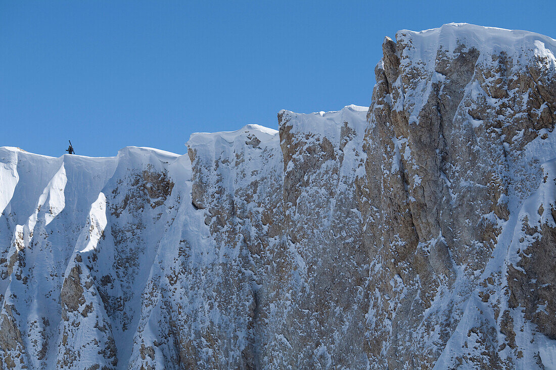 A lone skier hiking on an exposed ridge, Las Lenas, Argentina Las Lenas, Argentina