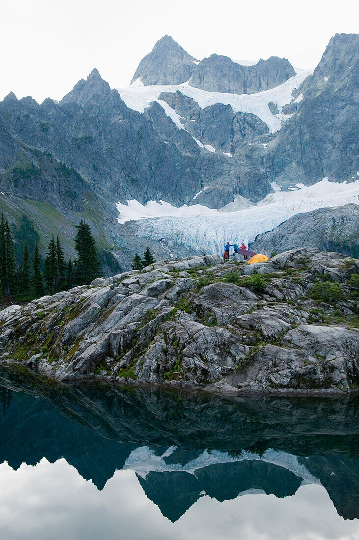 Two women camping at Lake Ann, Mount Baker Wilderness, Bellingham, Washington Bellingham, Washington, USA