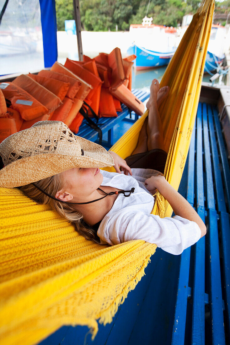 A woman relaxes in a hammock in Brazil Brazil