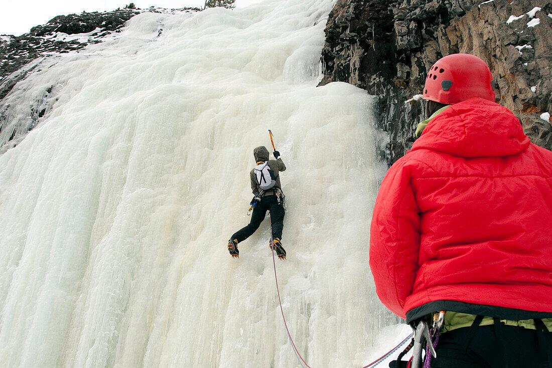 A man ice climbing Bozeman, Montana, USA