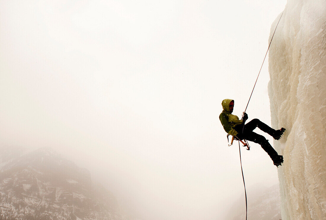 A man ice climbing Bozeman, Montana, USA