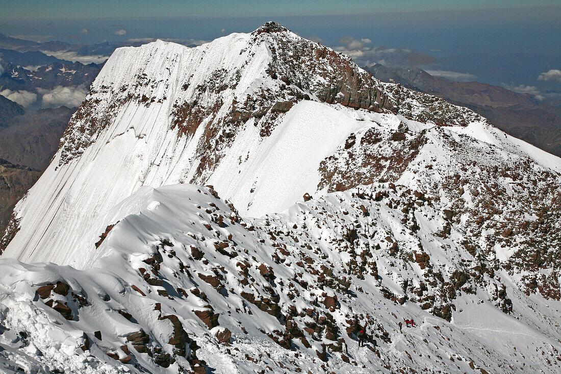 Aconcagua South Summit view and climbers ascending, from Aconcagua main summit at 6962 m Mendoza, Andes Mountains, Argentina