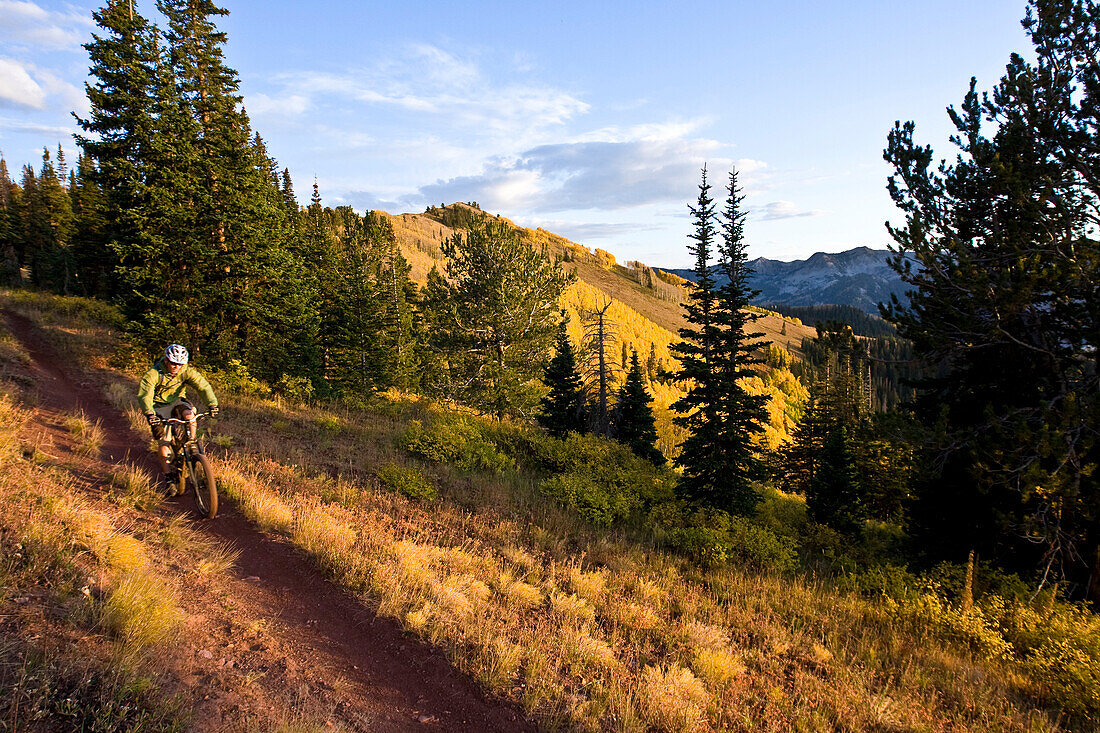 A man riding the Wasatch Crest trail on a crisp fall afternoon Utah, USA