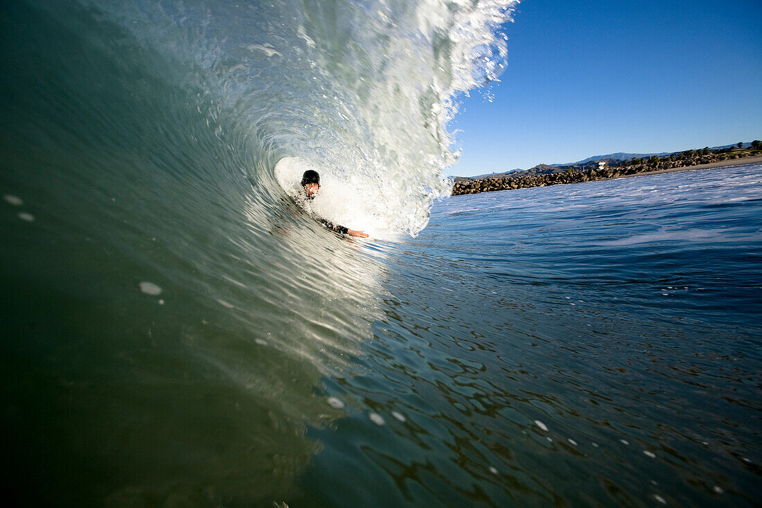 A male bodysurfer gets barrel Ventura, California, United States of America