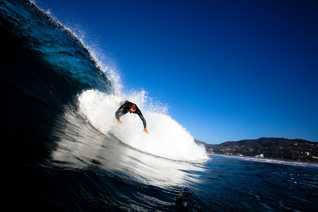 A male surfer gets launched from his board Malibu, California, United States of America