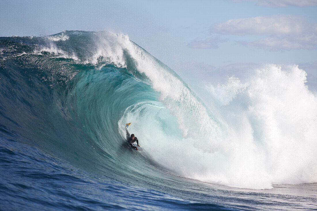A surfer bodyboarding a dangerous wave at Shipstern bluff, in Tasmania Tasman Peninsular, Tasmania, Australia