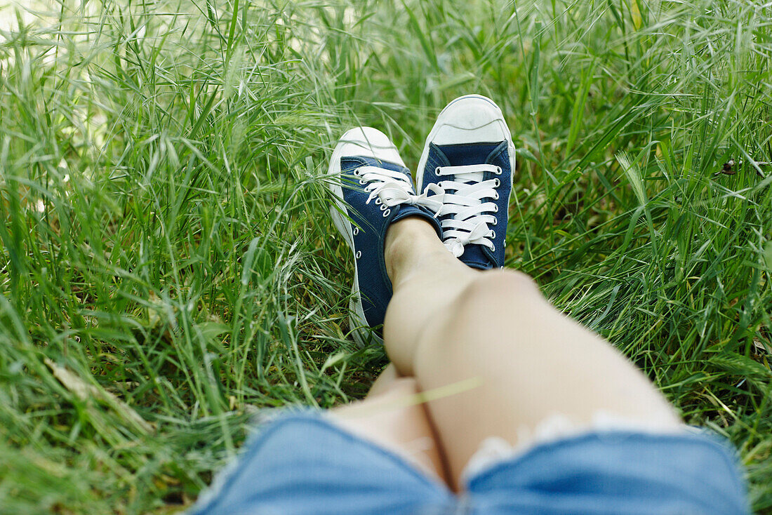 Asian woman laying in grass, Leo Carillio State Park, Malibu CA