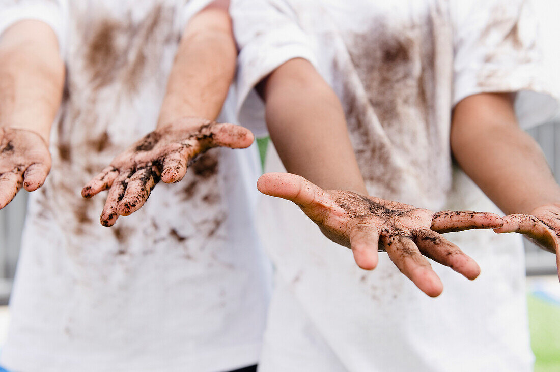 Boys displaying their messy hands, Jersey City, New Jersey, USA