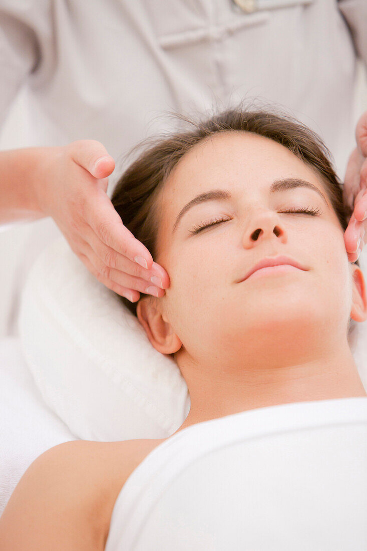 Woman having facial massage, Stowe, Vermont, USA