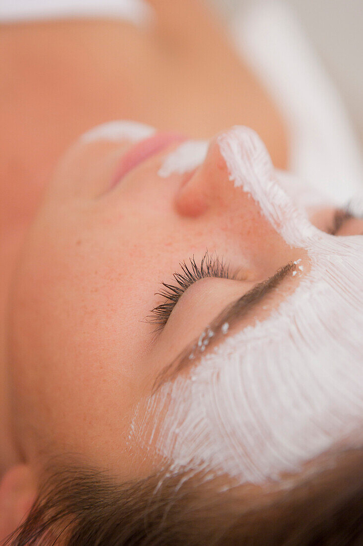 Woman having facial spa treatment, Stowe, Vermont, USA