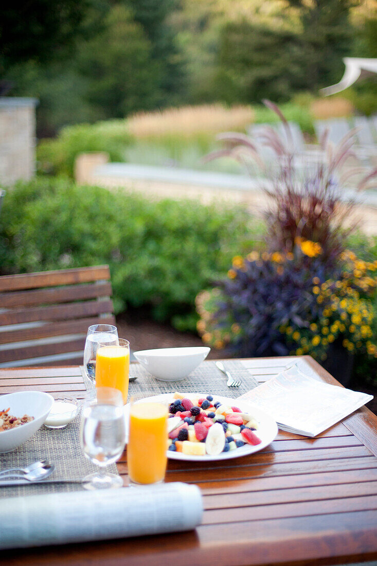Healthy breakfast on outdoor patio table, Stowe, Vermont, USA