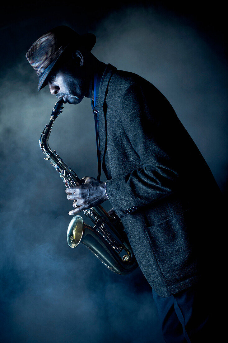 Black musician playing saxophone on stage, Rockville, Maryland, USA