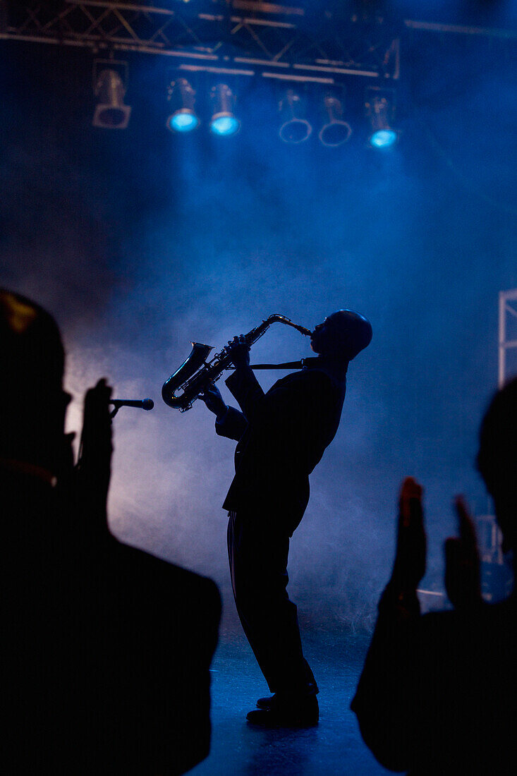 Black musician playing saxophone on stage, Rockville, Maryland, USA