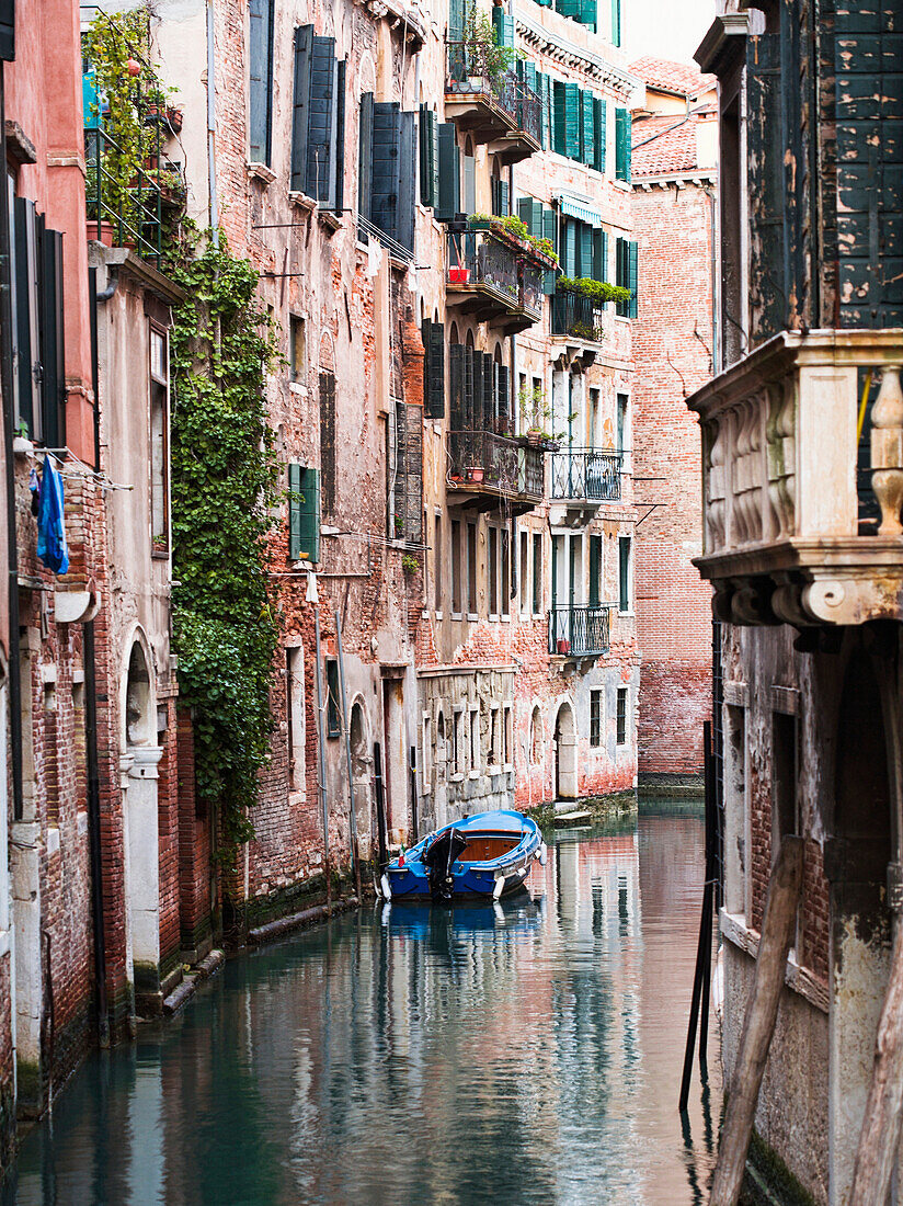 Boat moored in ornate canal, Venice, Venezia, Italy
