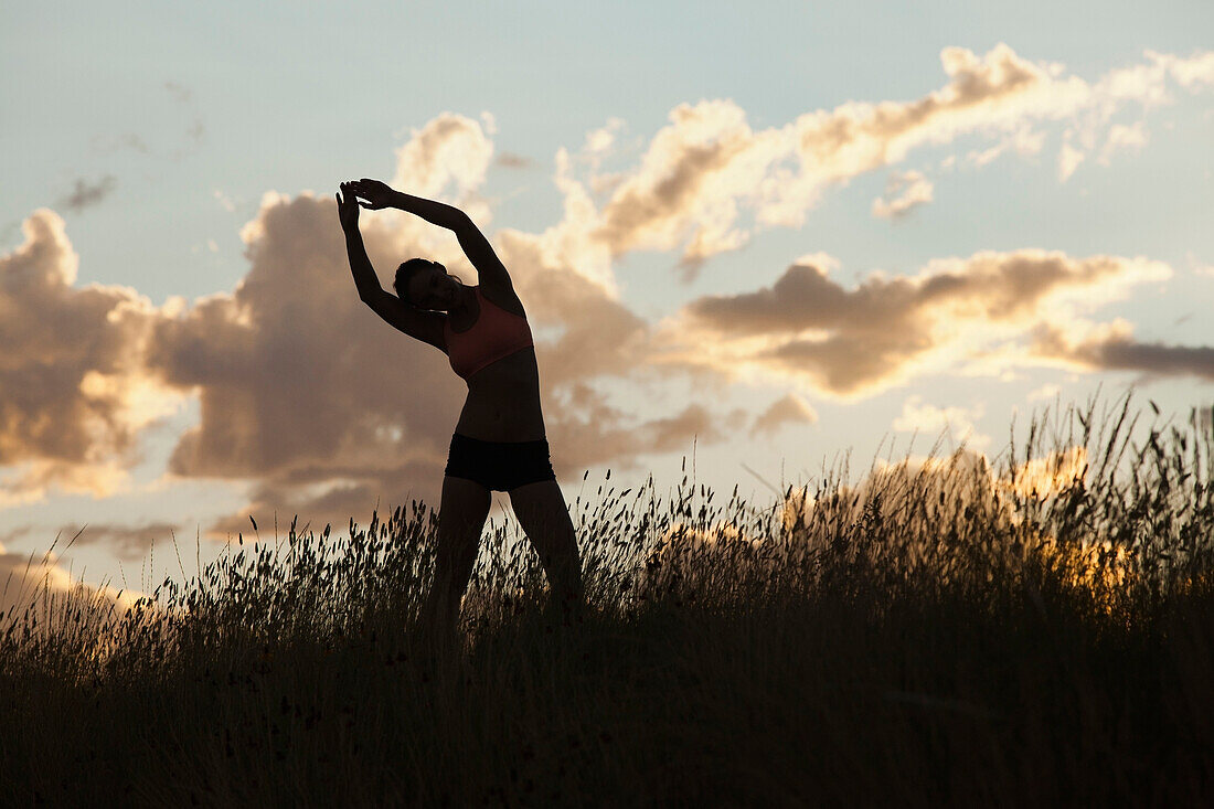 Caucasian woman stretching before exercise, South Jordan, Utah, United States