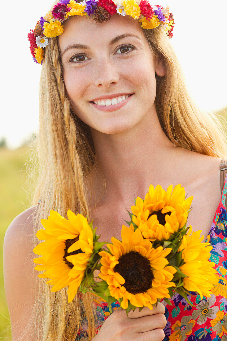 Tranquil Caucasian woman holding sunflowers, Olney, Maryland, USA